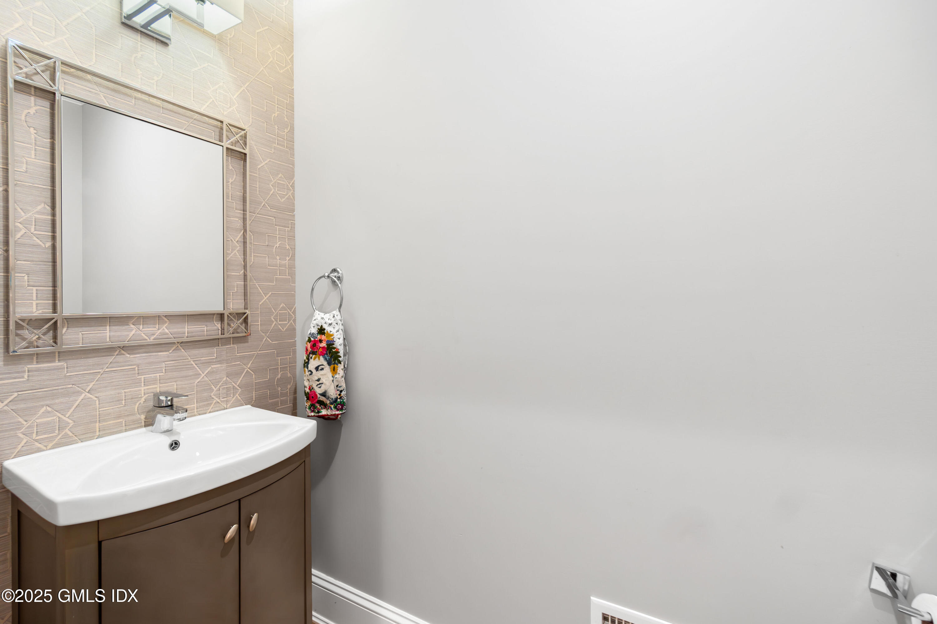 53 Long Meadow Road Riverside, CT 06878 - Photo 11 of 27 a bathroom with a sink and a mirror