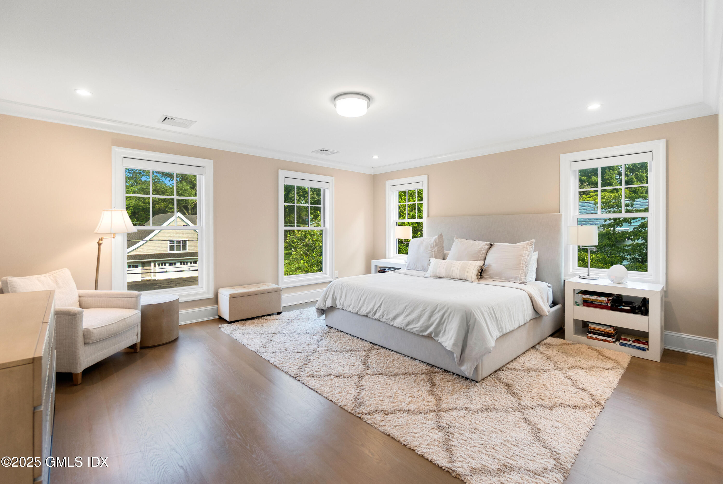 53 Long Meadow Road Riverside, CT 06878 - Photo 12 of 27 a spacious bedroom with a large bed and windows