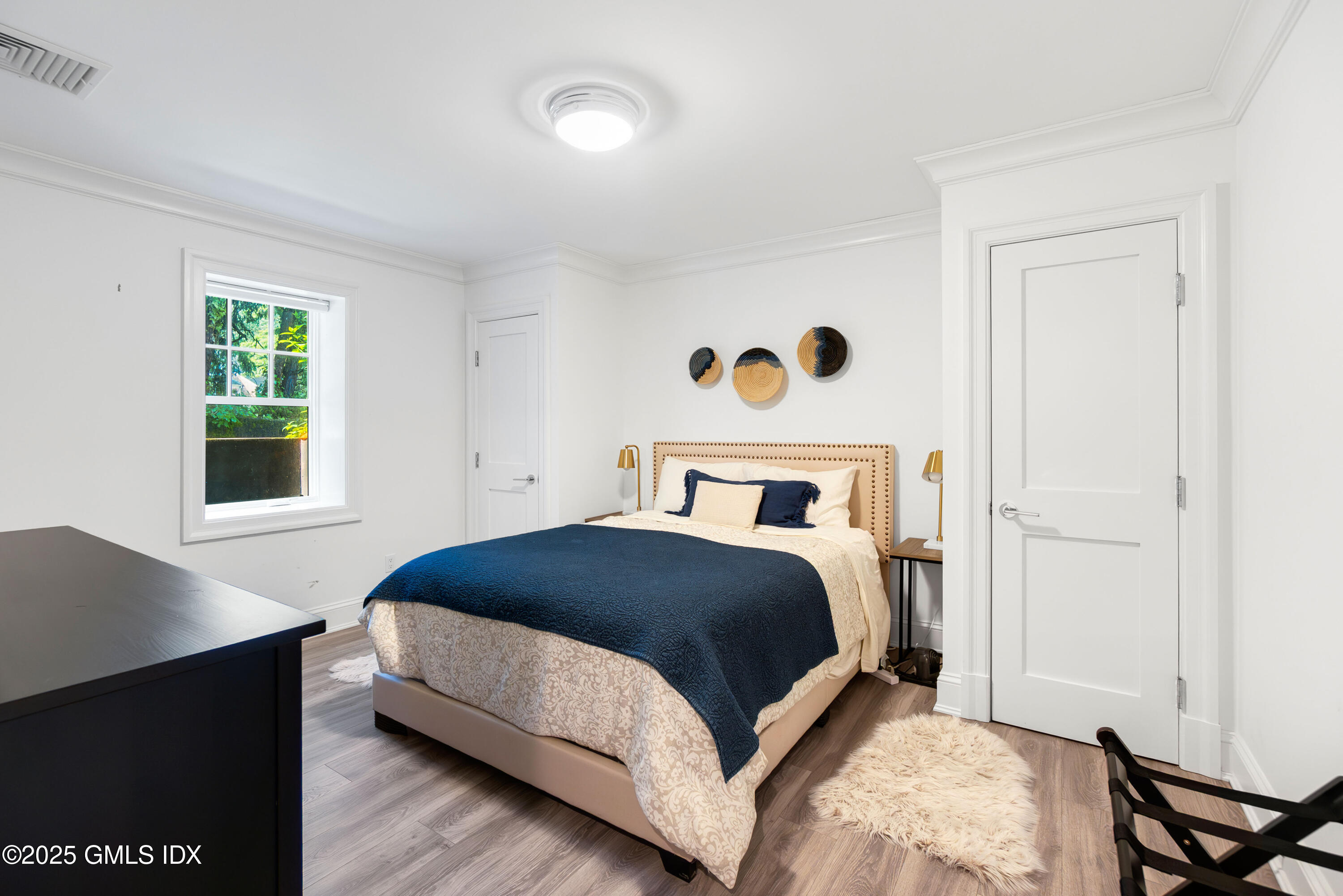 53 Long Meadow Road Riverside, CT 06878 - Photo 17 of 27 a bedroom with a bed and a window