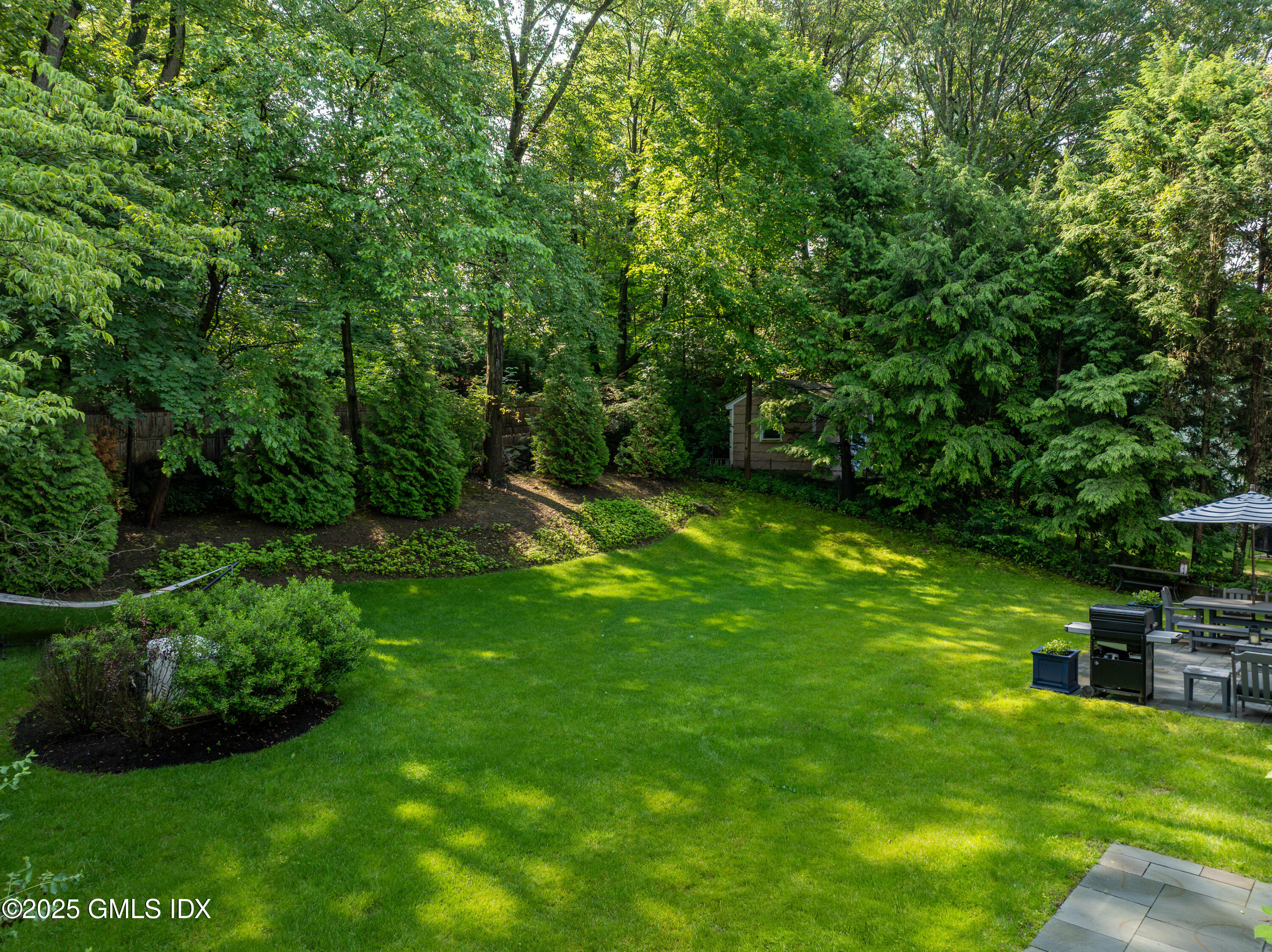 53 Long Meadow Road Riverside, CT 06878 - Photo 22 of 27 a view of a backyard with swimming pool