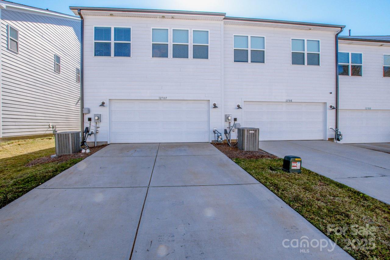 1270 Brawley School Road, Unit F Mooresville, NC 28117 - Photo 24 of 47 a view of a brick house with many windows