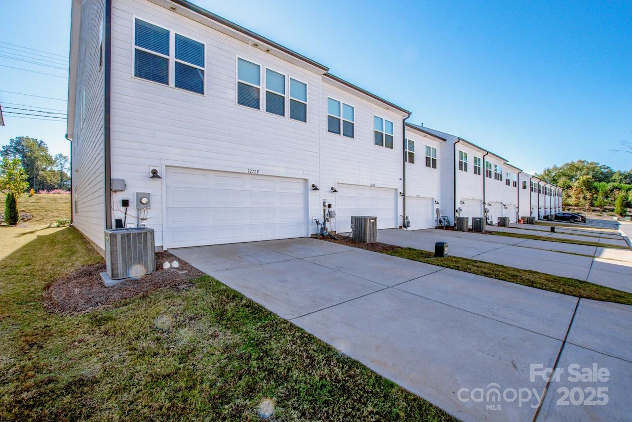 1270 Brawley School Road, Unit F Mooresville, NC 28117 - Photo 25 of 47 a house view with a backyard space