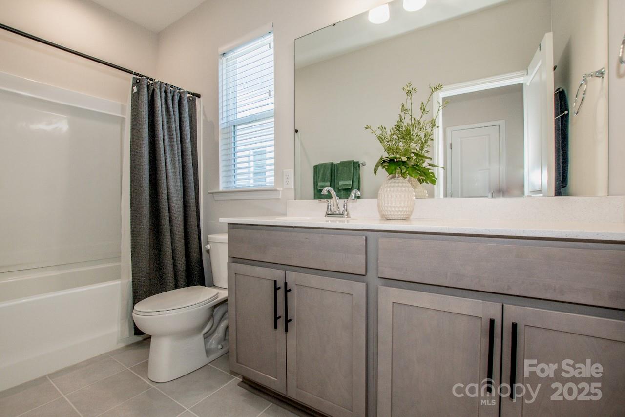 1270 Brawley School Road, Unit F Mooresville, NC 28117 - Photo 36 of 47 a bathroom with a sink toilet and shower