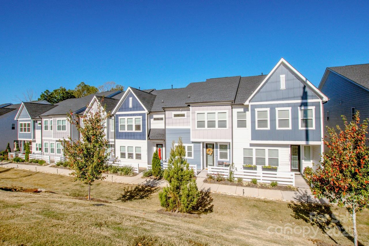 1270 Brawley School Road, Unit F Mooresville, NC 28117 - Photo 4 of 47 a front view of a house with a yard