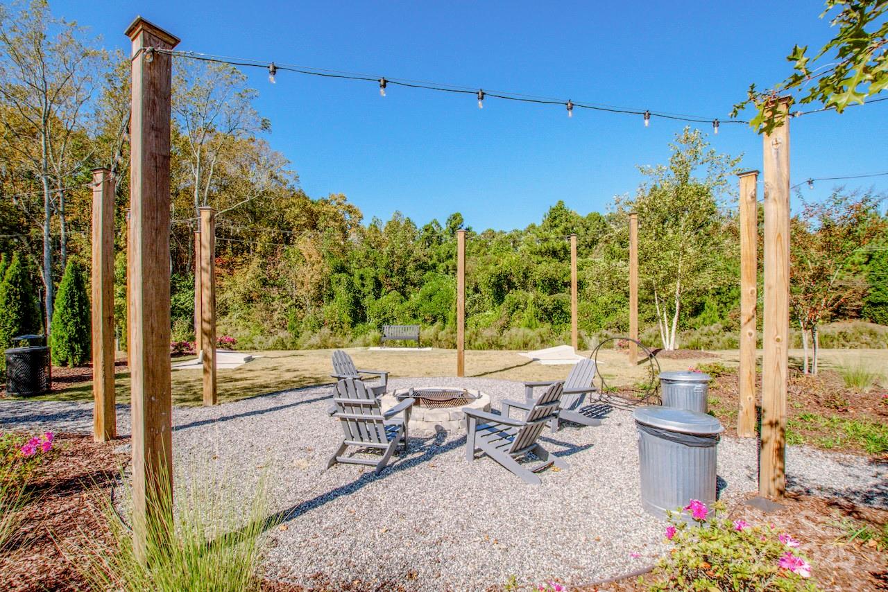 1270 Brawley School Road, Unit F Mooresville, NC 28117 - Photo 44 of 47 a view of a patio with chairs and potted plants