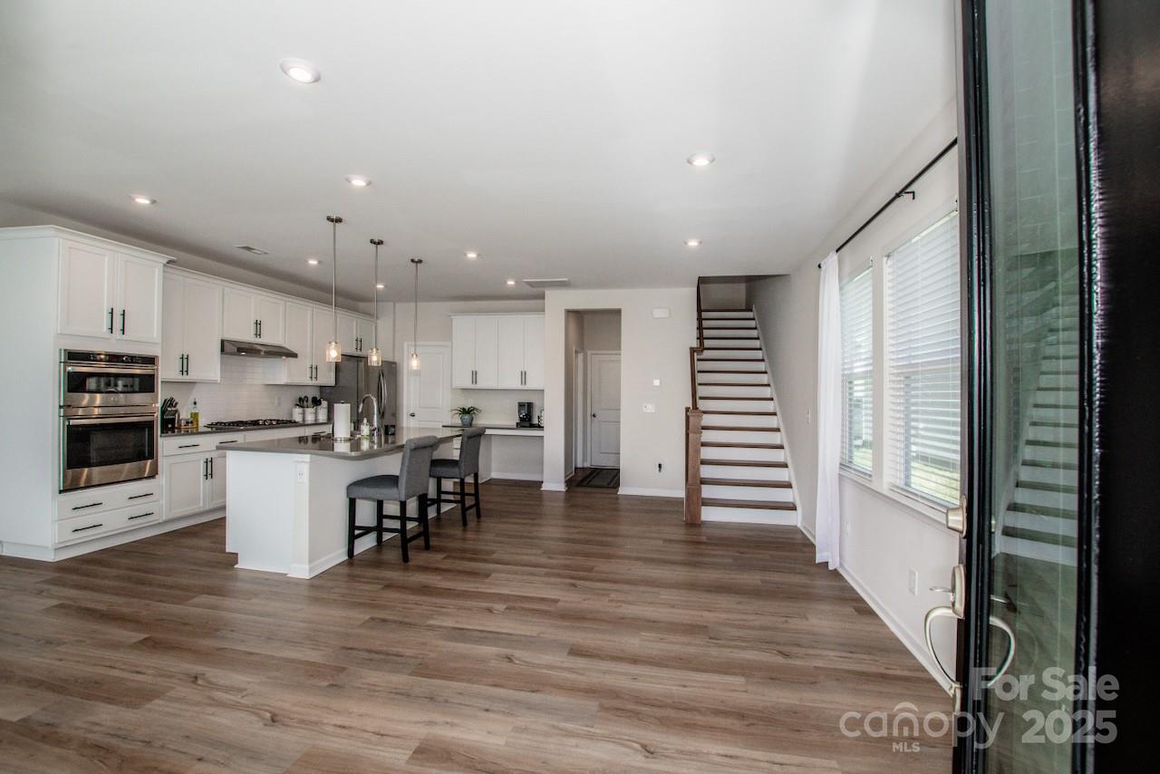 1270 Brawley School Road, Unit F Mooresville, NC 28117 - Photo 6 of 47 a kitchen with a table and chairs in it