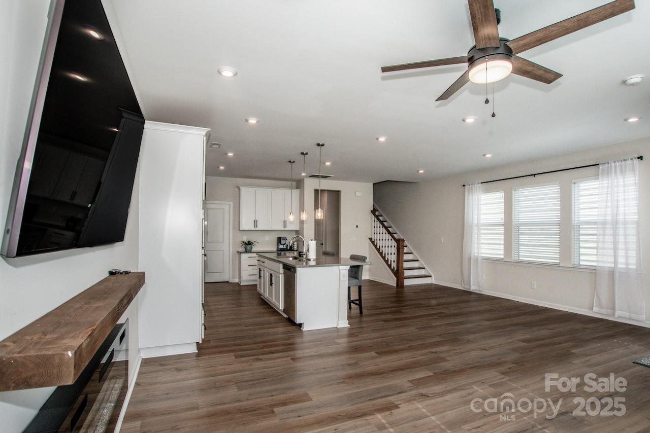 1270 Brawley School Road, Unit F Mooresville, NC 28117 - Photo 9 of 47 a view of a kitchen with dining table and chairs