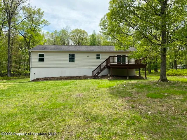 a house view with a garden space