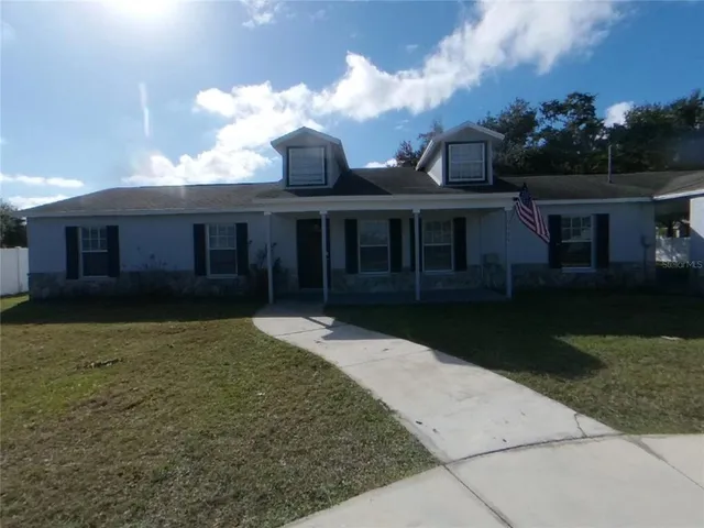 front view of a house with a yard
