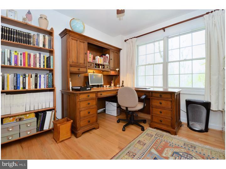 658 Knox Road Wayne, PA 19087 - Photo 17 of 25 a workspace with furniture bookshelf and a window