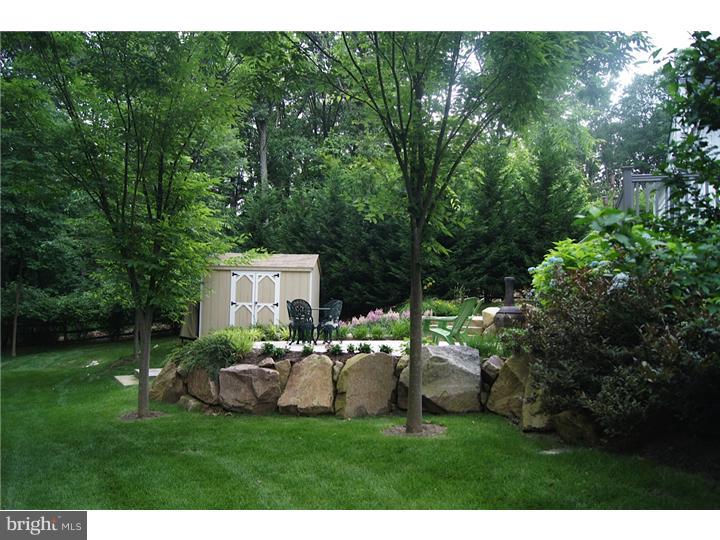 658 Knox Road Wayne, PA 19087 - Photo 23 of 25 a view of a house with a yard and sitting area