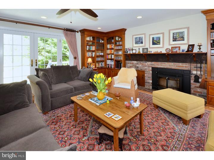 658 Knox Road Wayne, PA 19087 - Photo 9 of 25 a living room with furniture and a fireplace