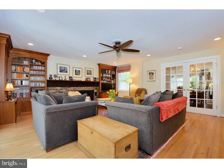 658 Knox Road Wayne, PA 19087 - Photo 10 of 25 a living room with furniture a ceiling fan and a rug