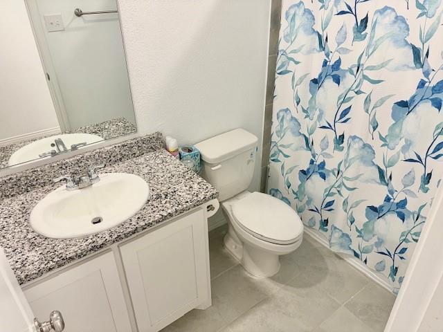 464 Reverie Way Ferris, TX 75125 - Photo 14 of 21 a bathroom with a granite countertop sink and a mirror