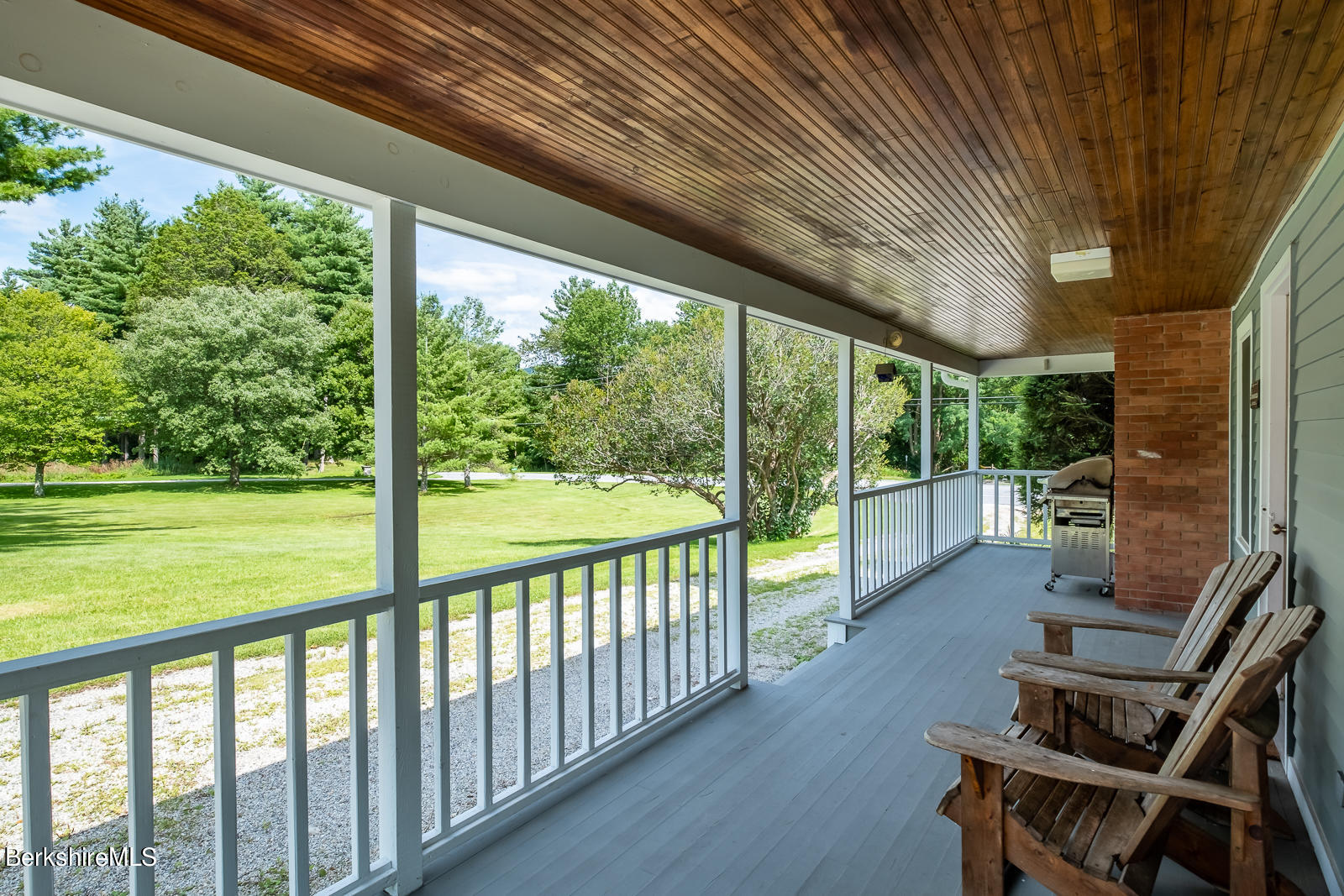 319 Hancock Road Williamstown, MA 01267 - Photo 7 of 39 a view of a porch with chairs and backyard
