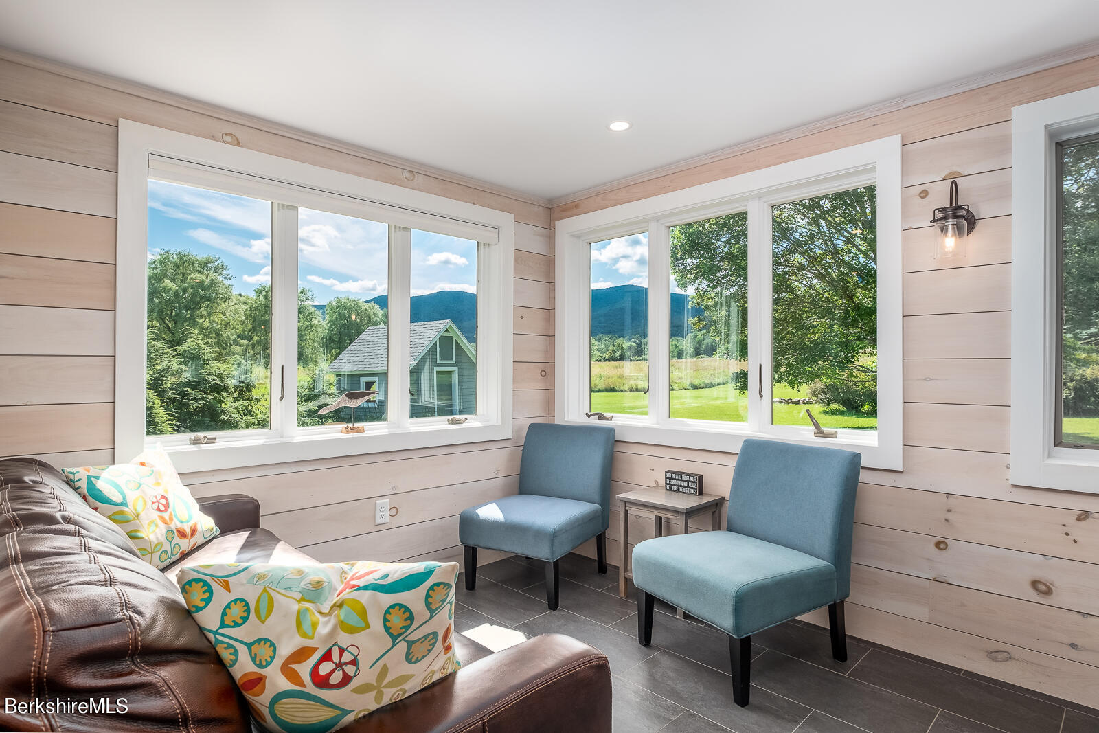 319 Hancock Road Williamstown, MA 01267 - Photo 10 of 39 a living room with furniture and a large window