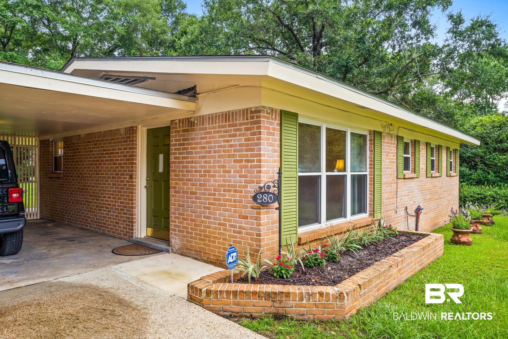 280 Thrift Street Mobile, AL 36609 - Photo 2 of 22 View of side of home featuring a carport