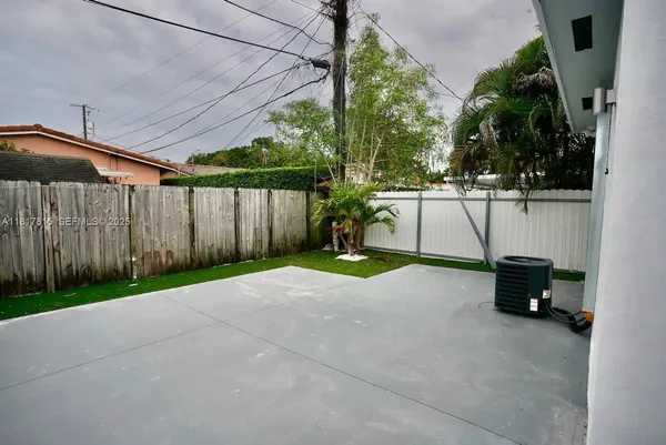 a view of backyard with seating space