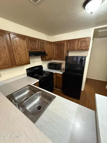 a kitchen with a stove and a cabinet