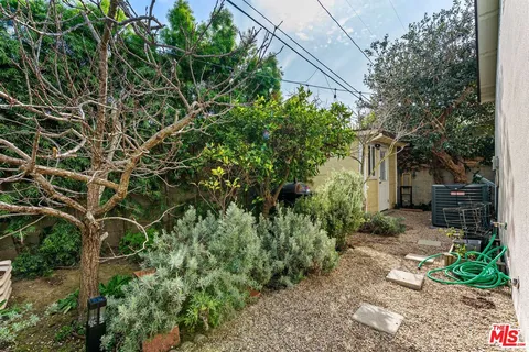 a view of a house with a tree