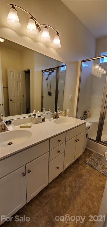 96 Catawba River Road Fletcher, NC 28732 - Photo 12 of 20 a bathroom with a double vanity sink and mirror