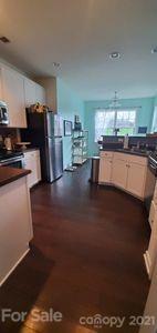 96 Catawba River Road Fletcher, NC 28732 - Photo 4 of 20 a kitchen with stainless steel appliances wooden floor and view living room