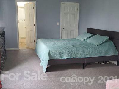 96 Catawba River Road Fletcher, NC 28732 - Photo 10 of 20 a bedroom with a bed and a painting on the wall