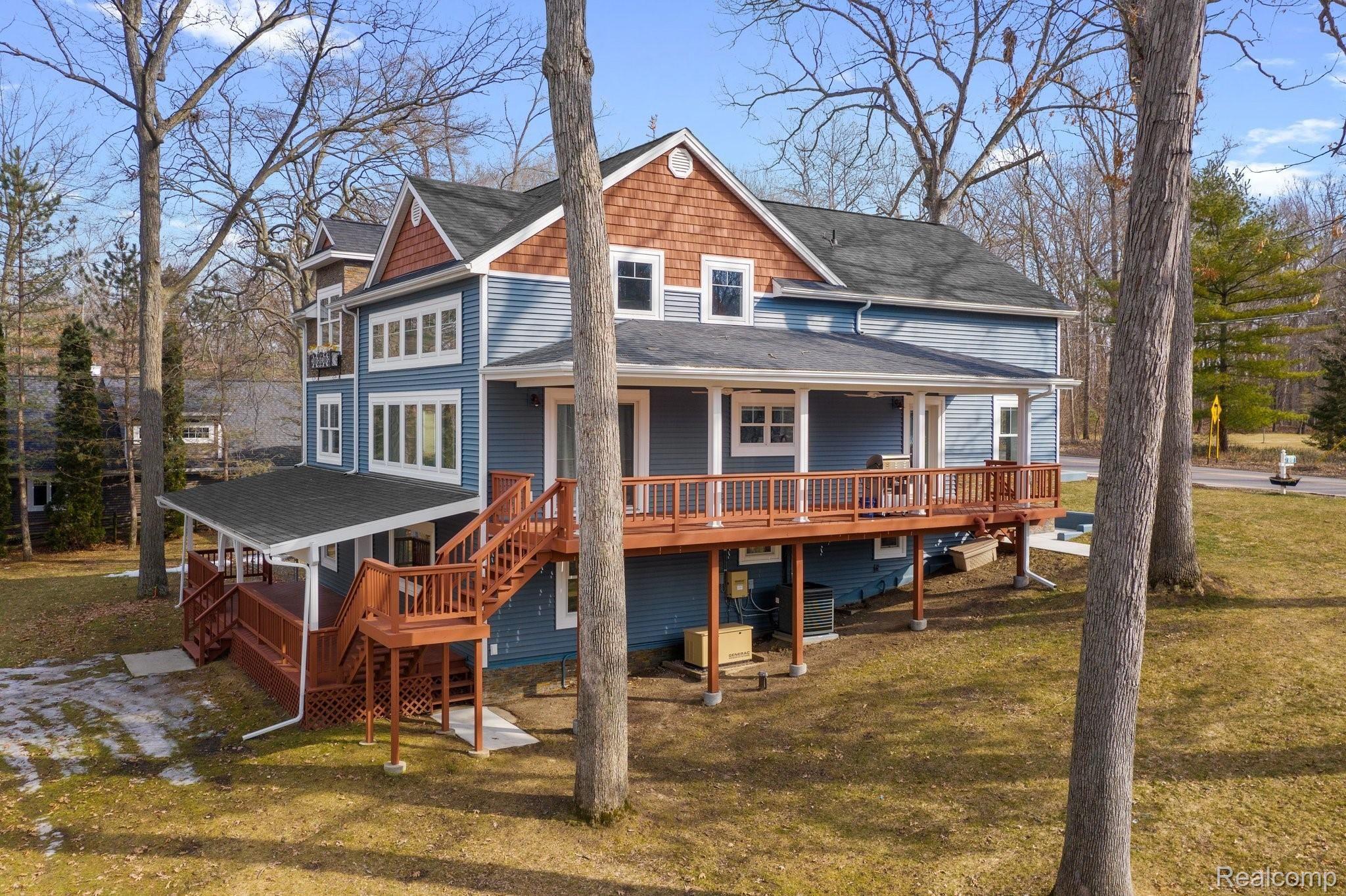 4485 Cordley Lake Road Pinckney, MI 48169 - Photo 4 of 35 4485 Cordley Lake Road side view