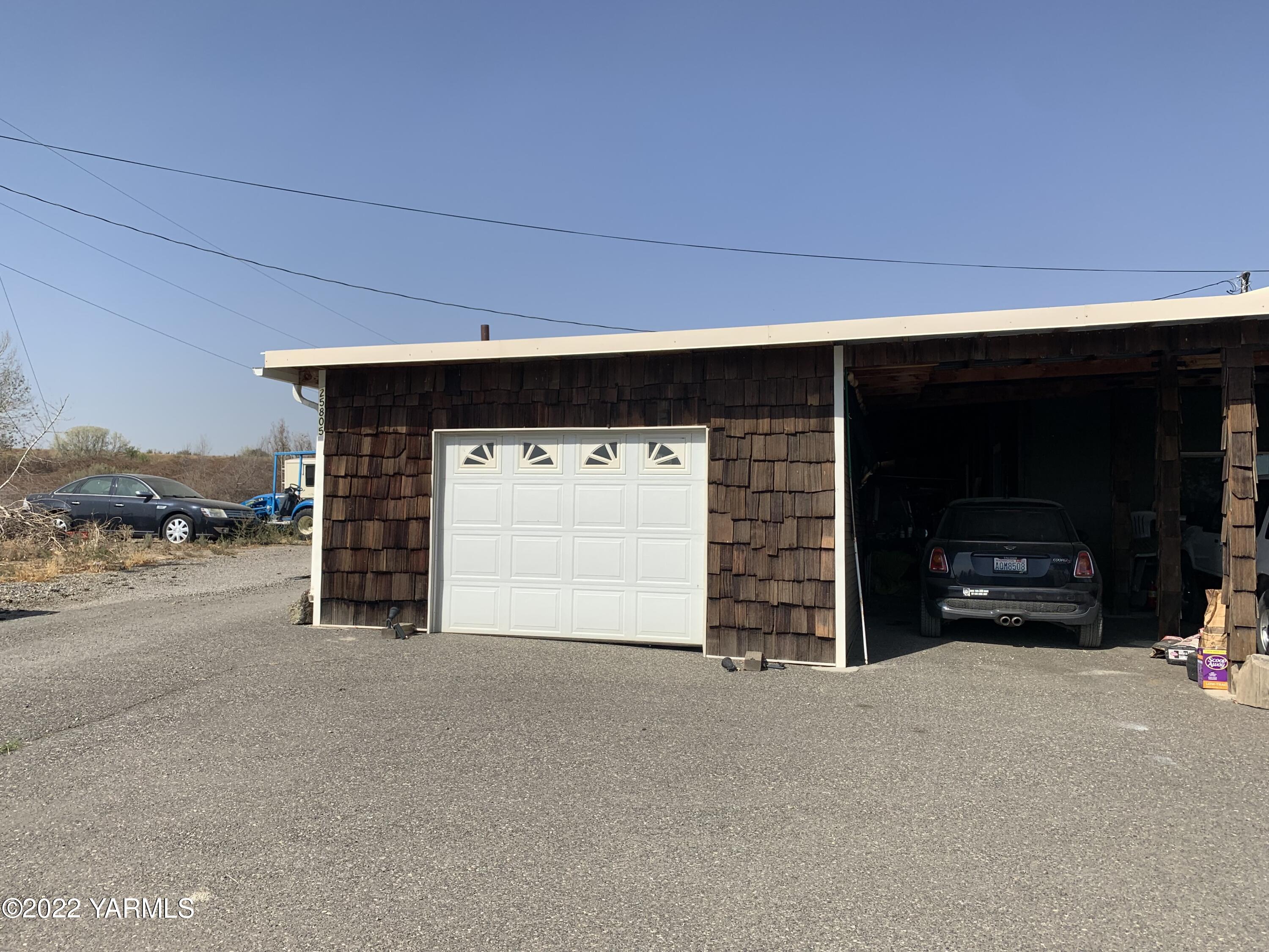 25807 North Beers Road Prosser, WA 99350 - Photo 47 of 53 a view of empty room with garage and fireplace