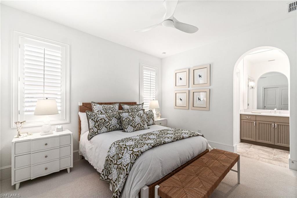 16755 Lucarno Way Naples, FL 34110 - Photo 22 of 50 a bed room with a bed and a window