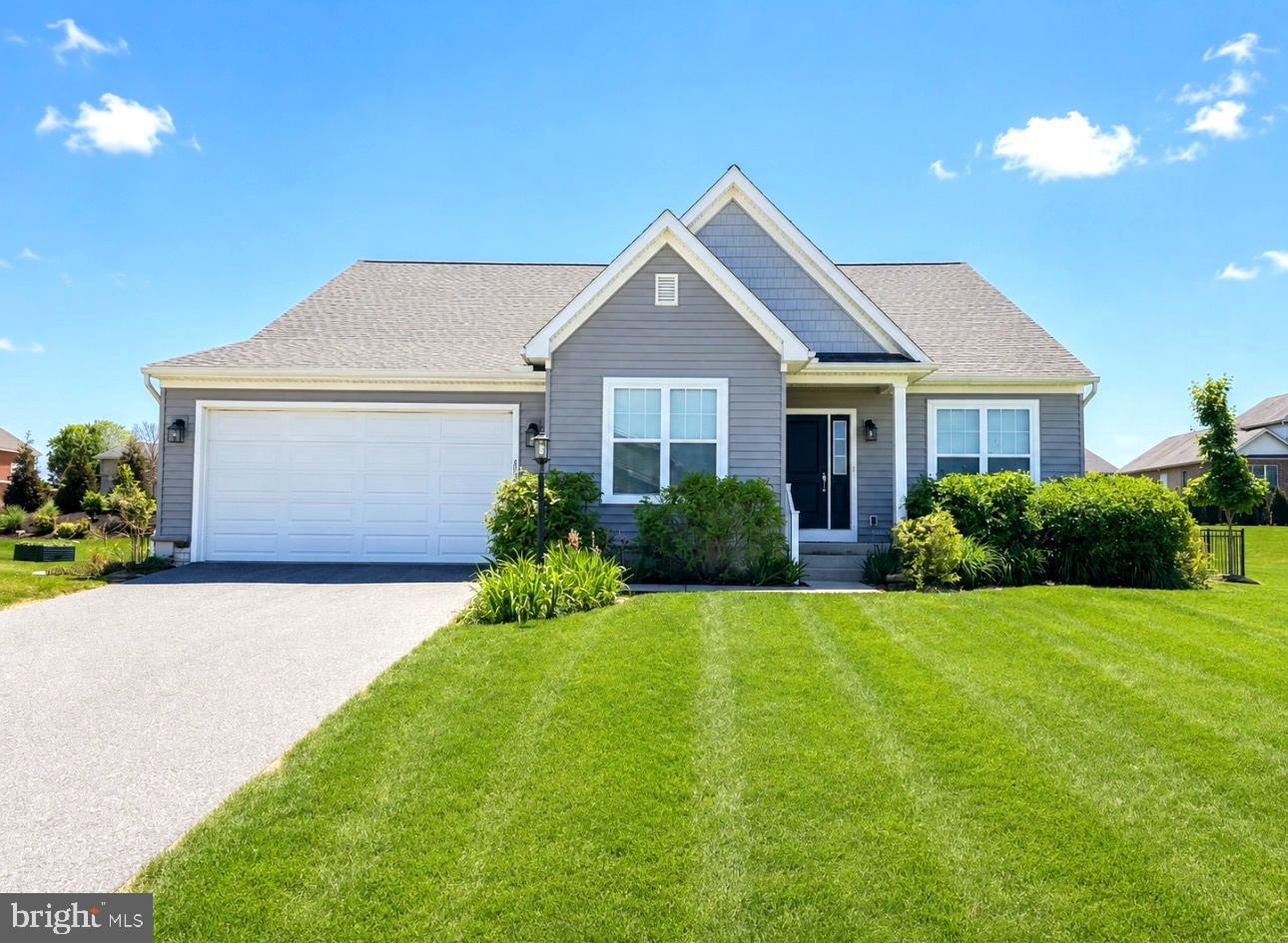 2309 Palomino Road Dover, PA 17315 - Photo 1 of 7 a front view of a house with a yard