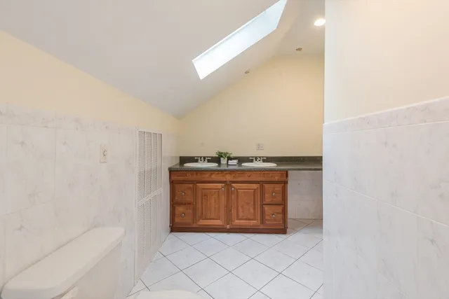 a view of bathroom with bathtub and vanity