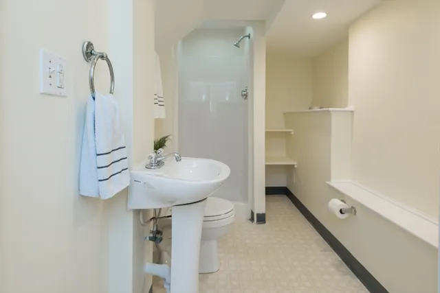 a bathroom with a sink and mirror