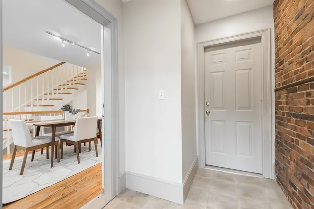 a view of dining room with furniture and wooden floor