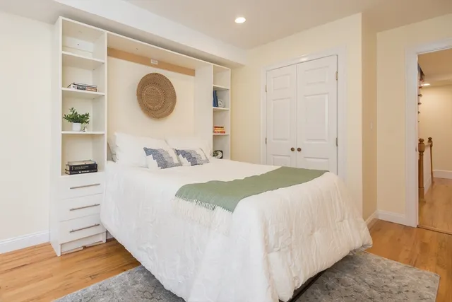 a bedroom with a bed and a closet