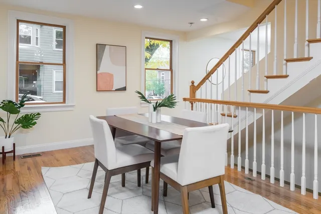 a view of a livingroom with furniture window and wooden floor