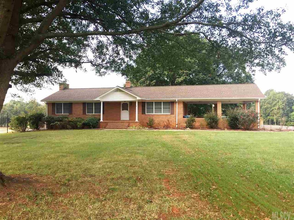 2187 Startown Road Newton, NC 28658 - Photo 2 of 21 a front view of a house with a garden