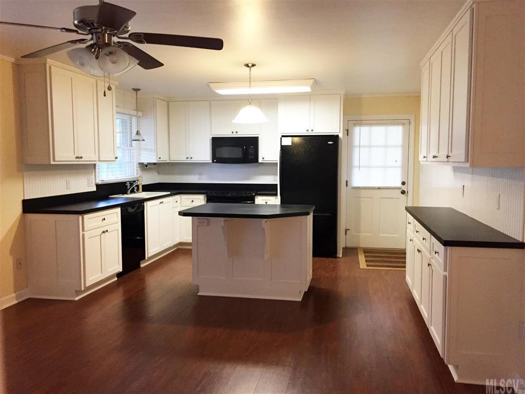 2187 Startown Road Newton, NC 28658 - Photo 15 of 21 a kitchen with stainless steel appliances granite countertop a stove a sink a refrigerator and a microwave