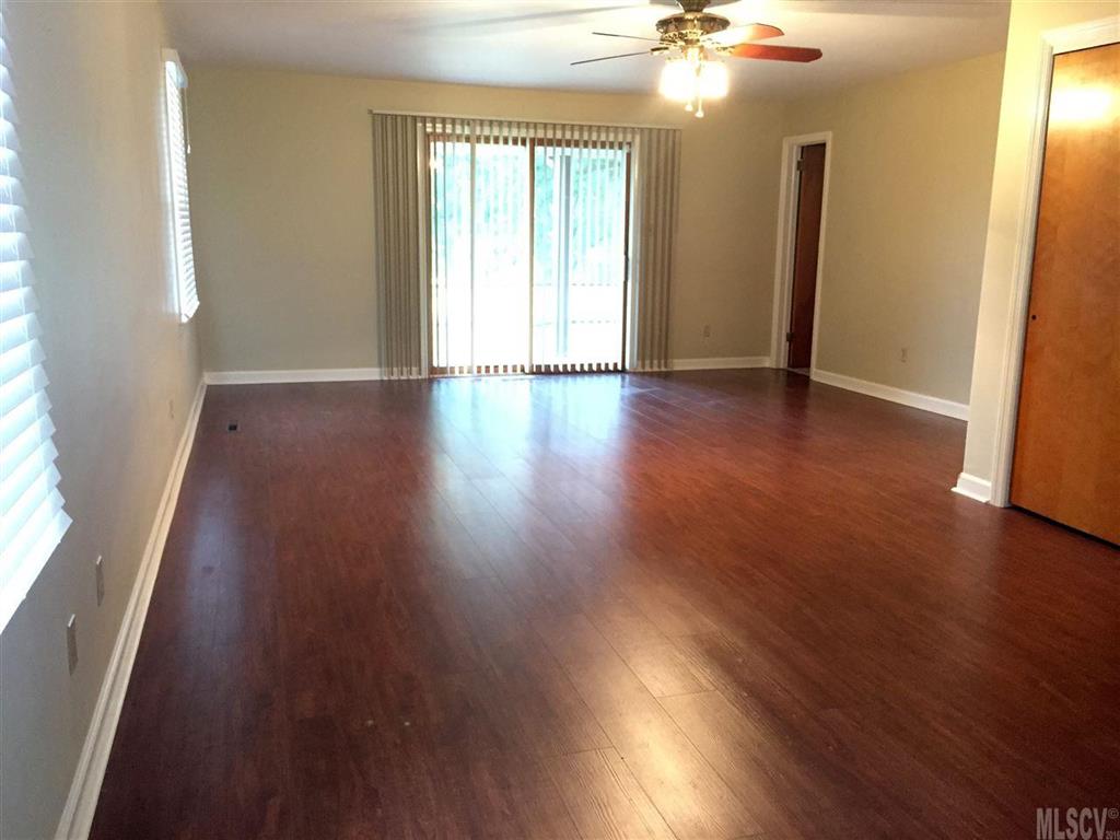 2187 Startown Road Newton, NC 28658 - Photo 21 of 21 an empty room with wooden floor and windows