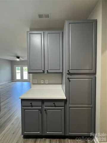 a kitchen with cabinets and stainless steel appliances