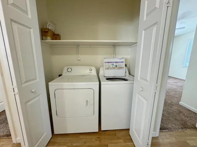 a view of storage and utility room with washer and dryer
