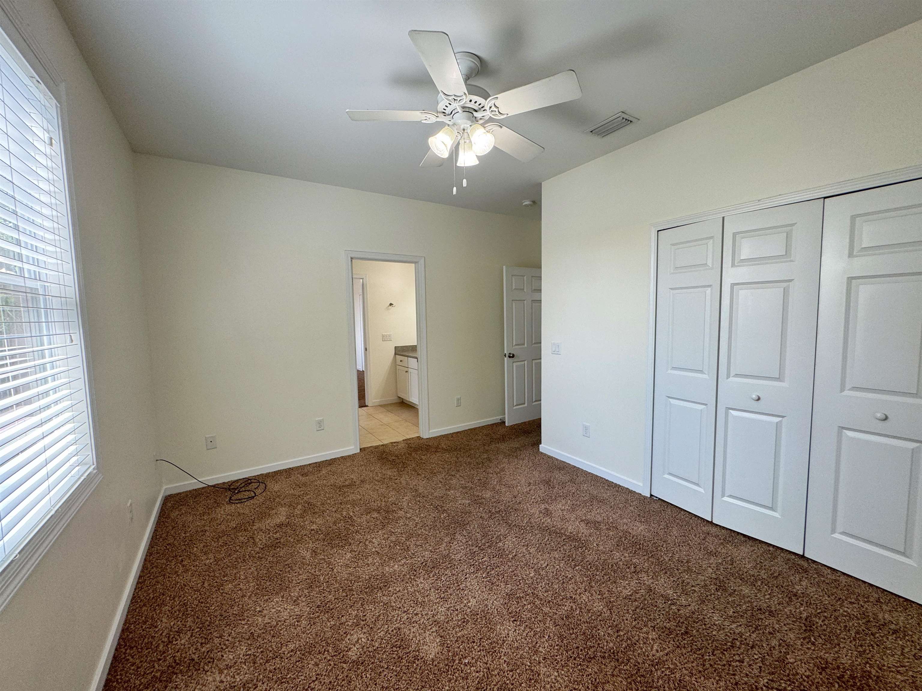 38 Weeden Street, Unit A St. Augustine, FL 32084 - Photo 15 of 29 a view of a livingroom with a ceiling fan and window