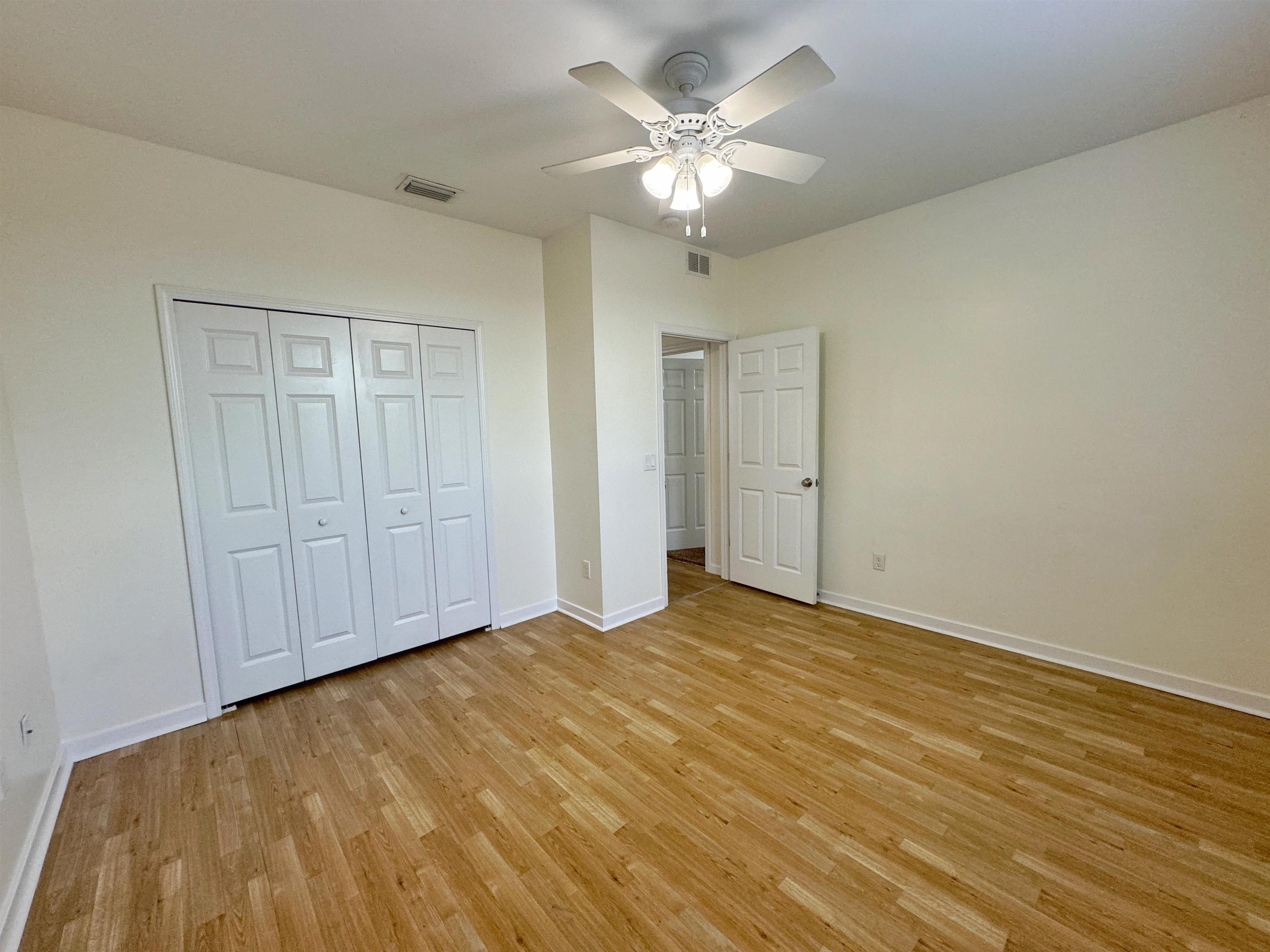 38 Weeden Street, Unit A St. Augustine, FL 32084 - Photo 21 of 29 a view of an empty room with chandelier fan