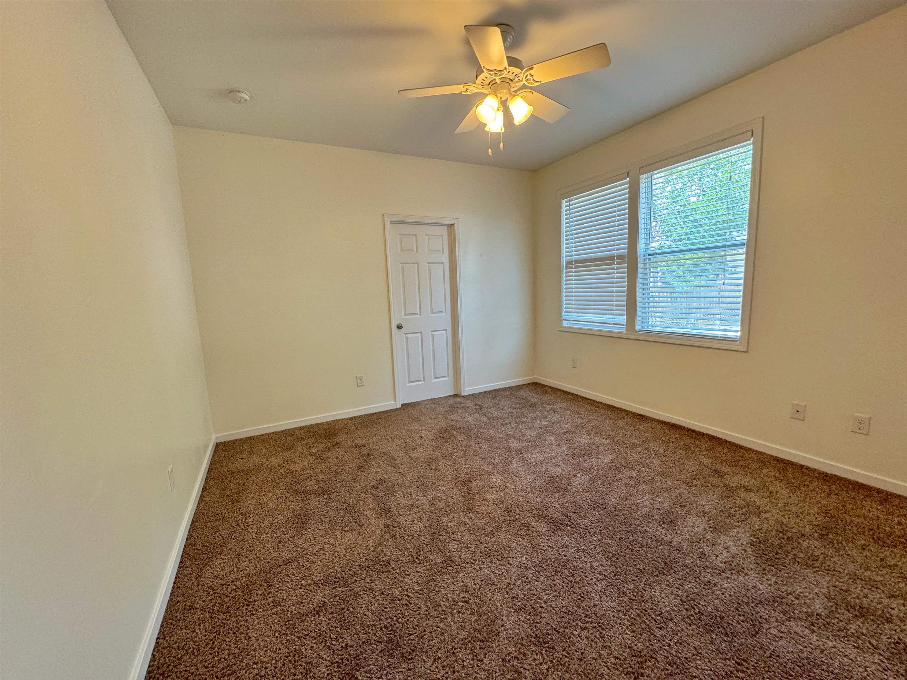 38 Weeden Street, Unit A St. Augustine, FL 32084 - Photo 23 of 29 an empty room with windows and fan