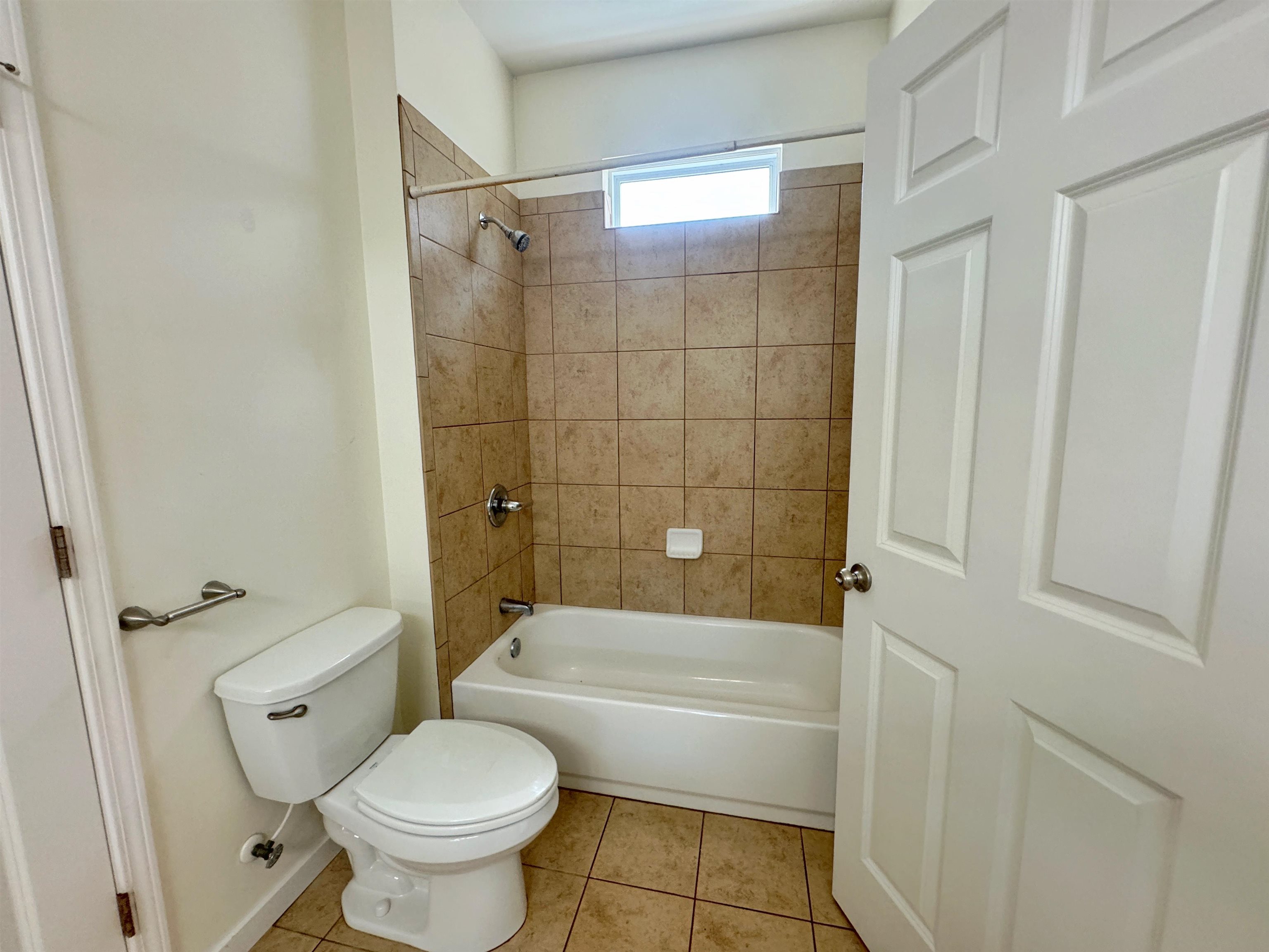 38 Weeden Street, Unit A St. Augustine, FL 32084 - Photo 25 of 29 a bathroom with a toilet and a bath tub