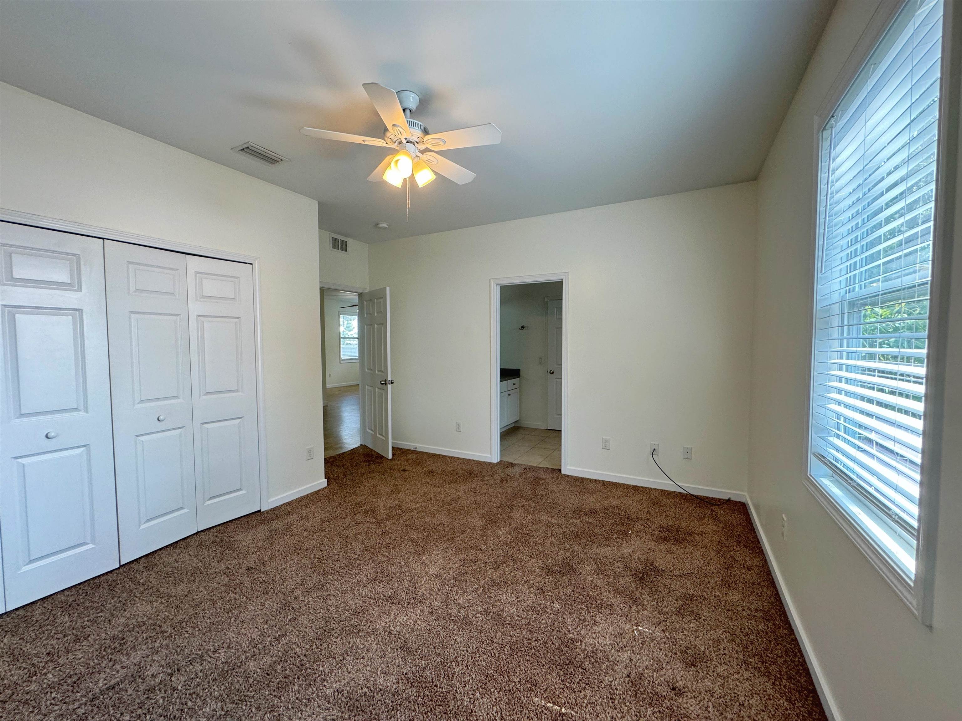 38 Weeden Street, Unit A St. Augustine, FL 32084 - Photo 28 of 29 wooden floor in an empty room with a window