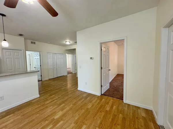 a view of a livingroom with wooden floor