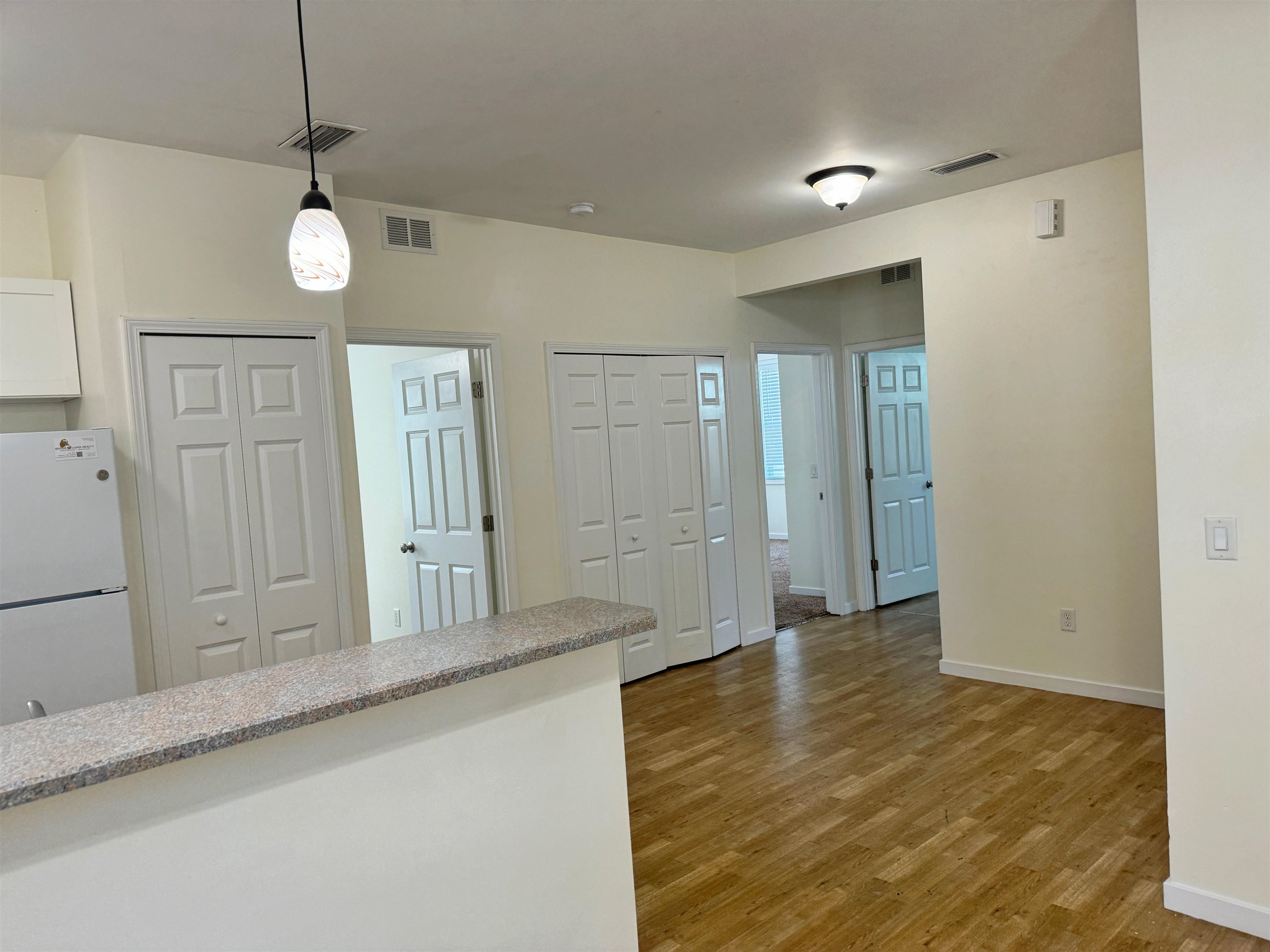 38 Weeden Street, Unit A St. Augustine, FL 32084 - Photo 7 of 29 a view of a hallway with wooden floor and staircase