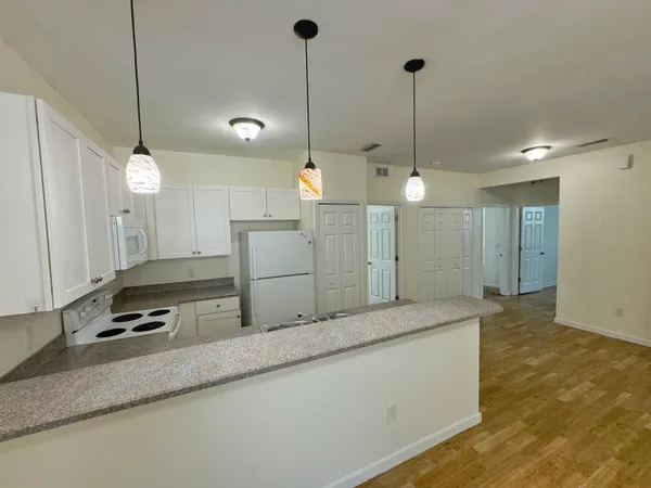 a kitchen with counter top space and stainless steel appliances