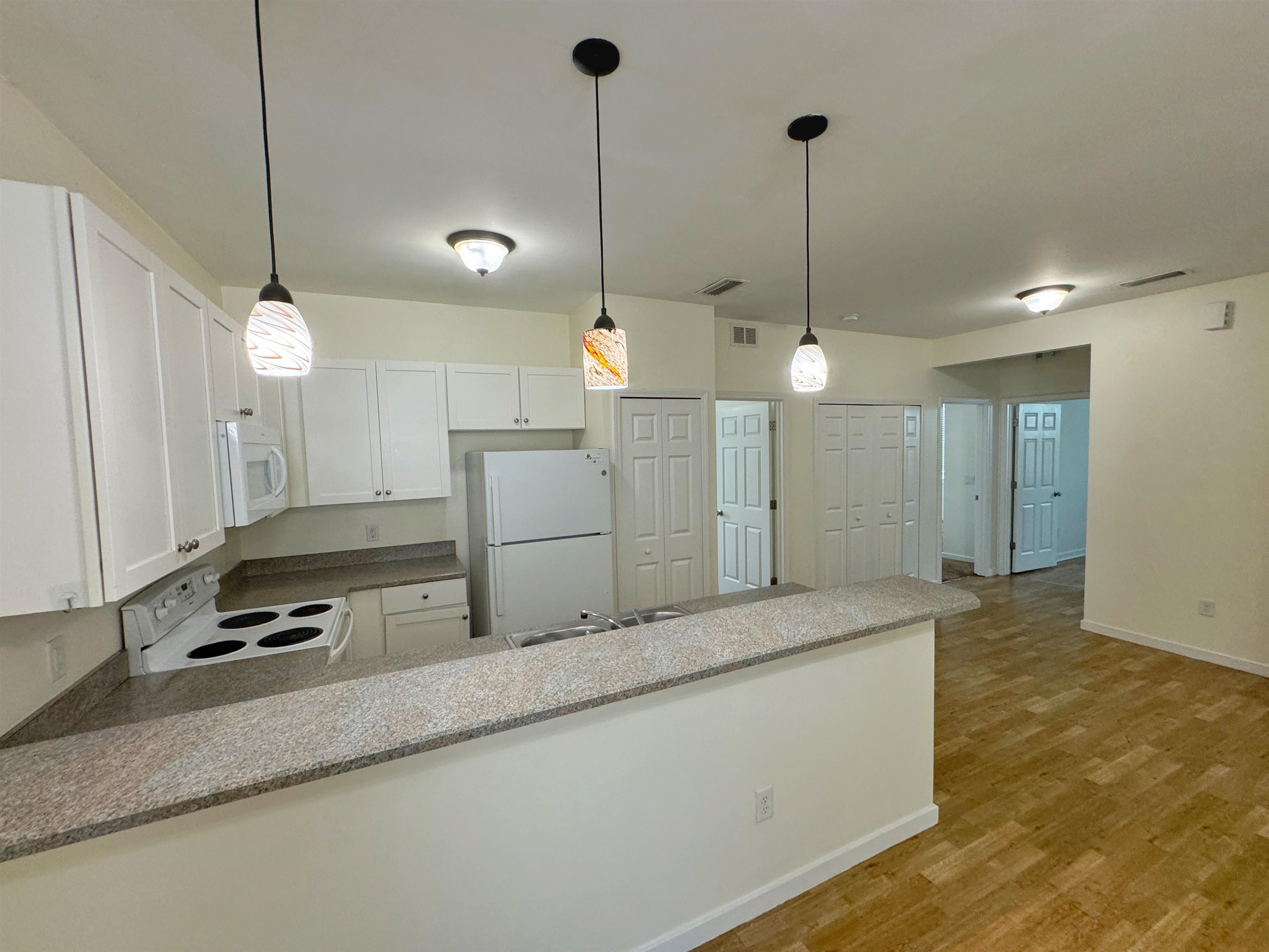 38 Weeden Street, Unit A St. Augustine, FL 32084 - Photo 8 of 29 a kitchen with counter top space and stainless steel appliances